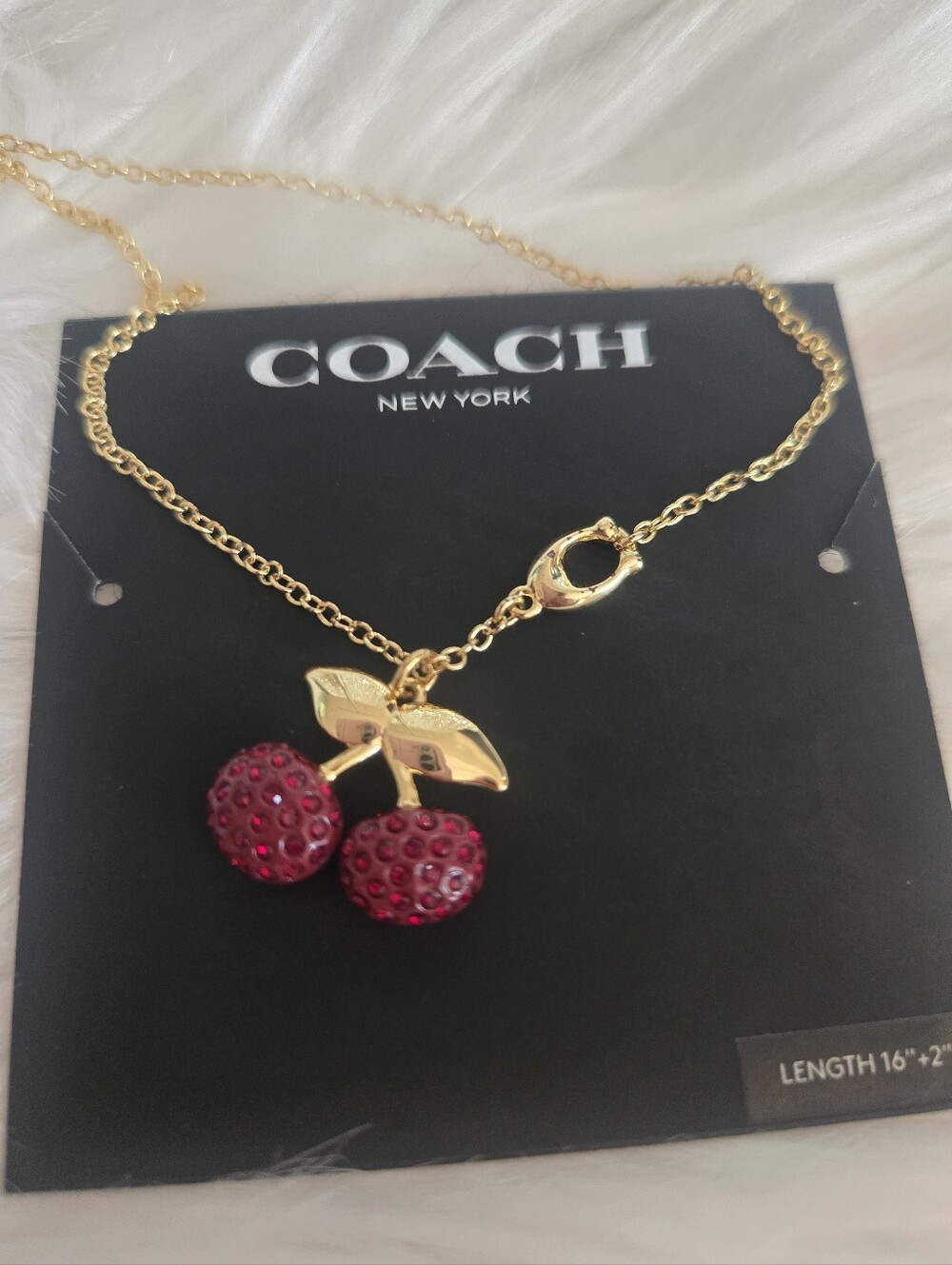 COACH Gold-Tone Cherry Crystal Pendant Necklace